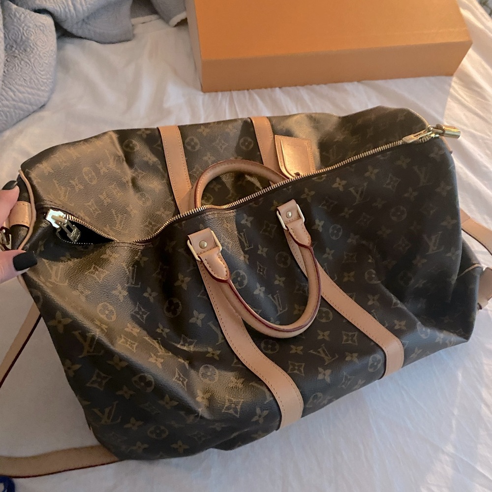 Authentic LV luggage. Comes with box, duster, lock and key. Used once.